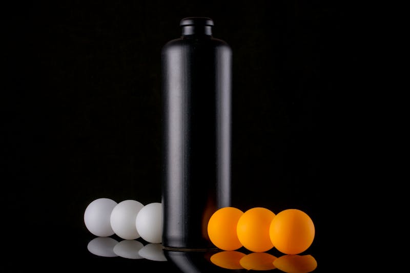 Baked Black Doris plum and coconut clafoutis in a shallow dish, golden on top and dusted with icing sugar, ready to serve in wedges.